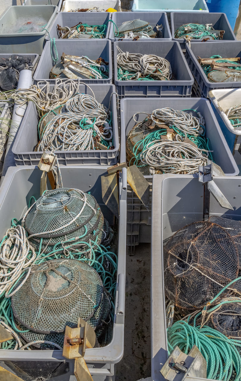 HIGH ANGLE VIEW OF FISHING NET ON METAL