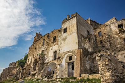 Low angle view of old building against sky