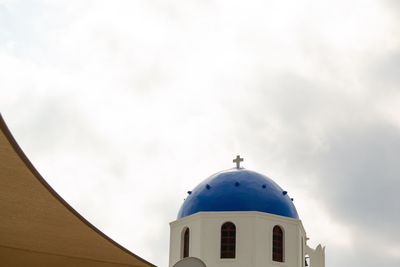 Low angle view of church and building against sky