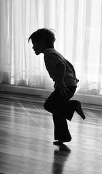 Full length of woman standing on floor