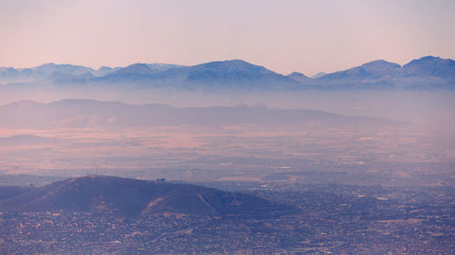 Scenic view of mountains against sky during sunset