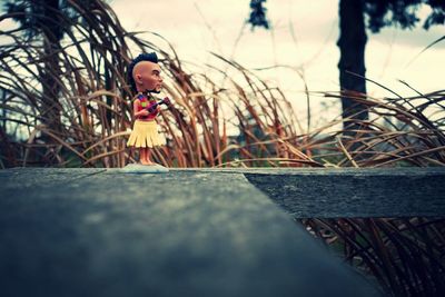 Human figurine on wooden table