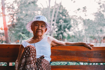 Portrait of woman against trees