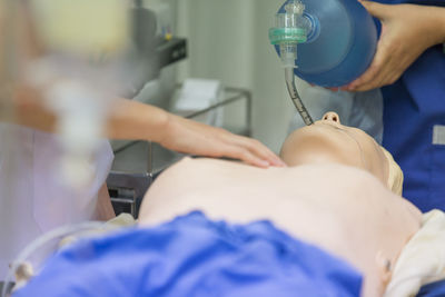 Cropped image of person learning cpr in hospital