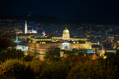 Buildings in city at night