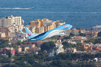 High angle view of buildings by sea