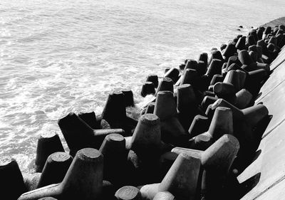 High angle view of rocks by sea