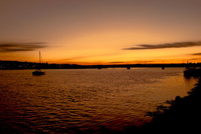 Scenic view of calm sea at sunset