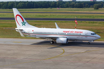 Side view of airplane on runway