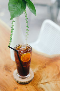 Close-up of iced americano coffee drink on table