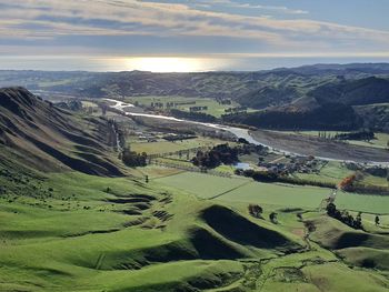 Aerial view of agricultural landscape against sky