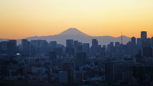 High angle view of cityscape against sky during sunset