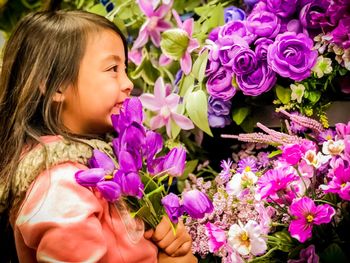 Close-up of girl with pink flowers