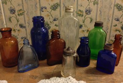 Close-up of bottles on wooden table