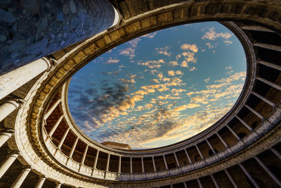 Low angle view of building against cloudy sky