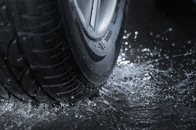 Close-up of water splashing by tire