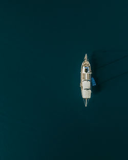 Low angle view of sailboat in sea at night