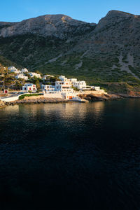 Kamares town with traditional white houses on sifnos island on sunset. greece