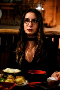 Young woman sitting at restaurant