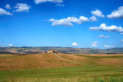 Scenic view of agricultural field against sky