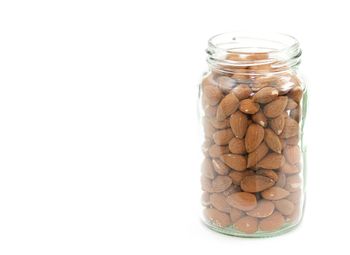 Close-up of jar against white background