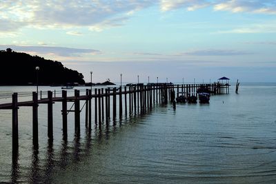 Pier on sea against sky