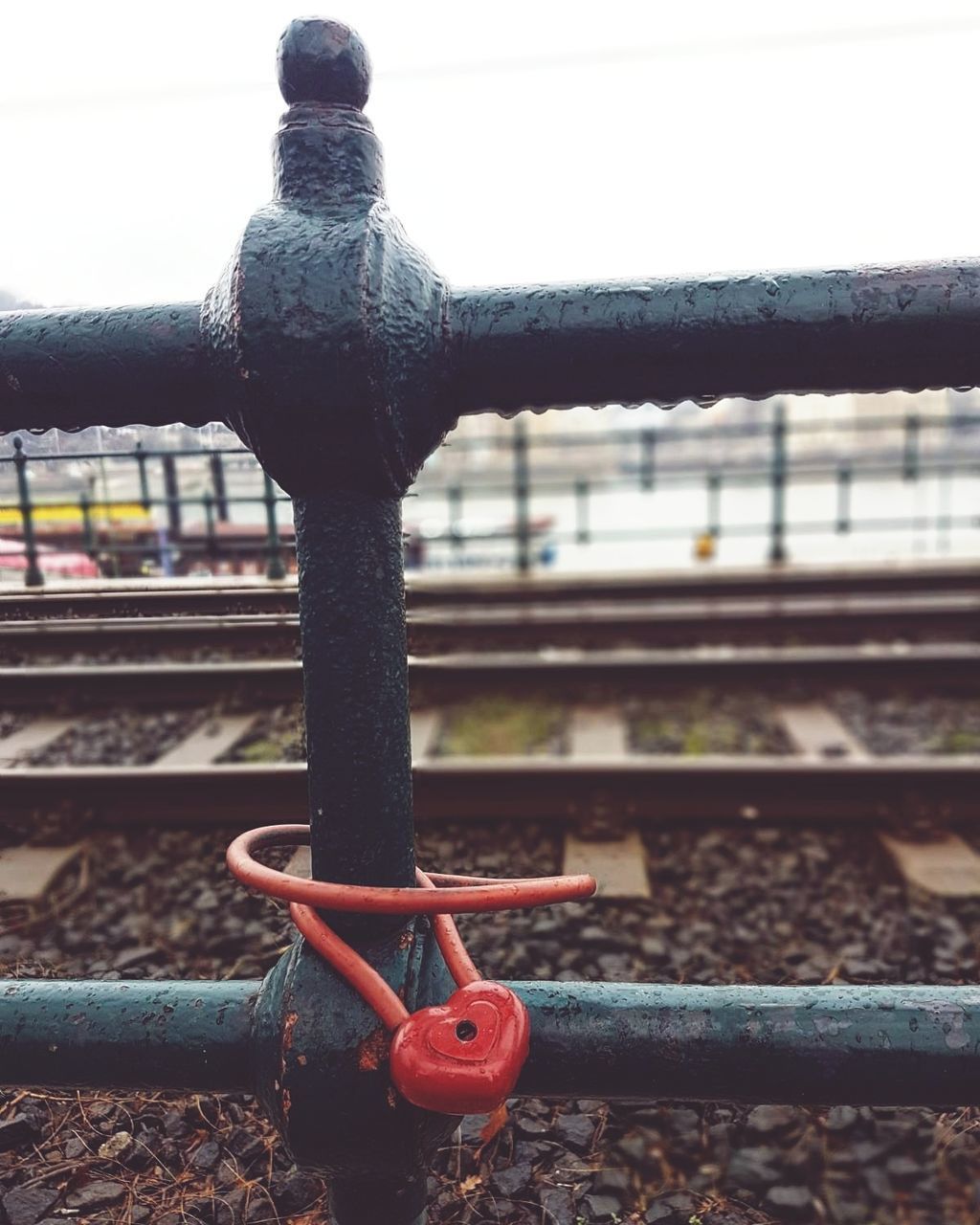 CLOSE-UP OF RUSTY METAL RAILROAD TRACK