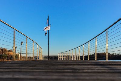 Low angle view of flag against blue sky