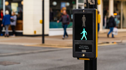 A pedestrian crossing showing the way forward