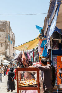 Woman in market stall in city