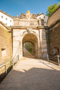 Archway of historic building against sky