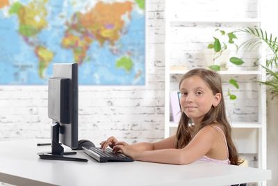 Close-up of girl using computer
