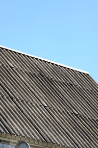 Low angle view of building against clear blue sky