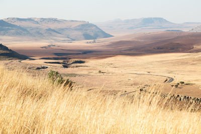 Scenic view of landscape and mountains against sky