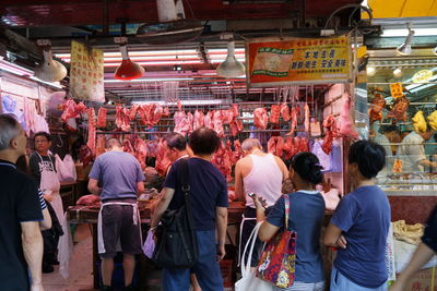 Group of people at market stall