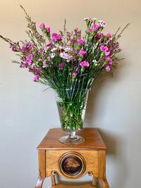 Close-up of flower vase against wall