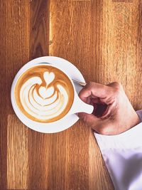 High angle view of coffee cup on table