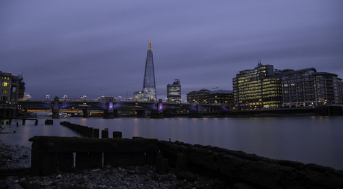 Illuminated city at waterfront