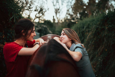 Women with horse in forest