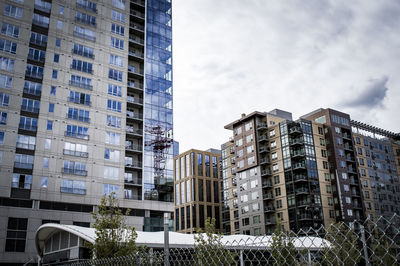 Low angle view of building against cloudy sky