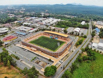 High angle view of soccer stadium in city