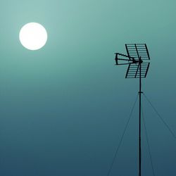 Low angle view of lamp post against clear blue sky