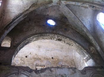 Low angle view of old ceiling in building