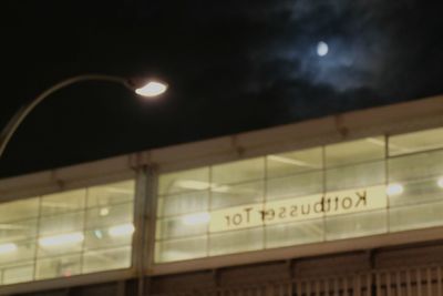 Low angle view of illuminated building against sky