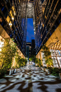 Low angle view of modern buildings in city at night