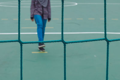 Low section of child playing with ball