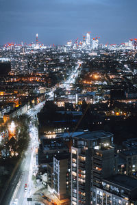 High angle view of illuminated city buildings at night