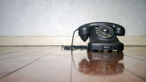 Close-up of telephone on table