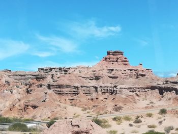 Scenic view of rock formations against sky