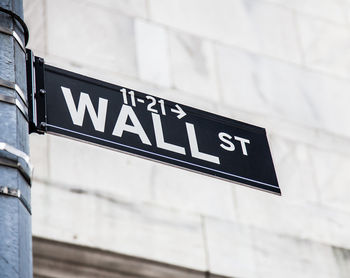 Low angle view of wall street sign